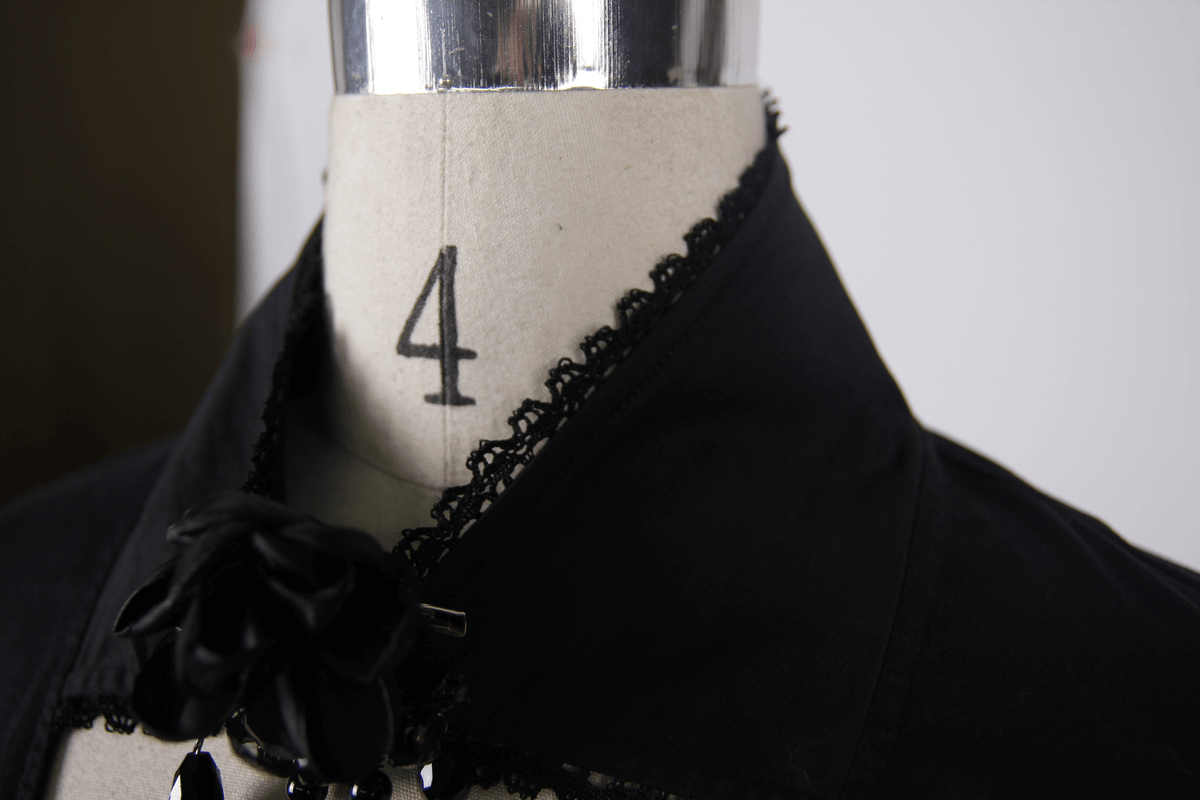 Elegant black gothic shirt with flower pendant and lace collar detailing, perfect for a chic gothic look.