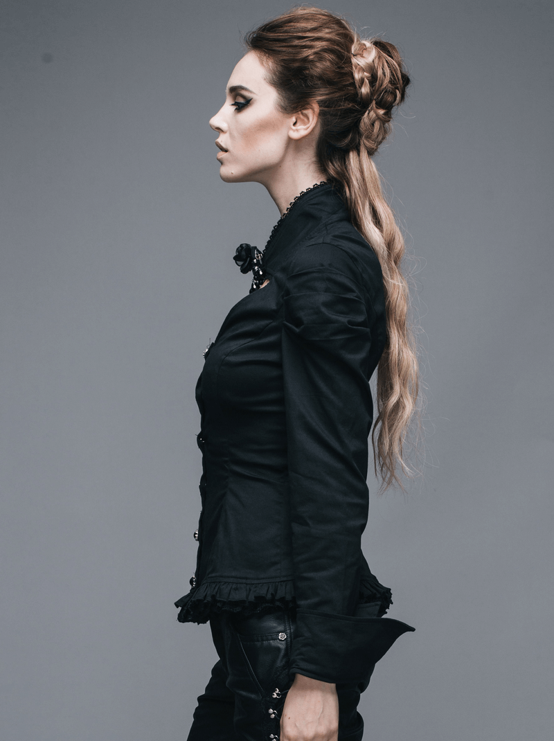 Elegant gothic black shirt featuring a flower pendant brooch, modeled by a woman with stylish long hair.