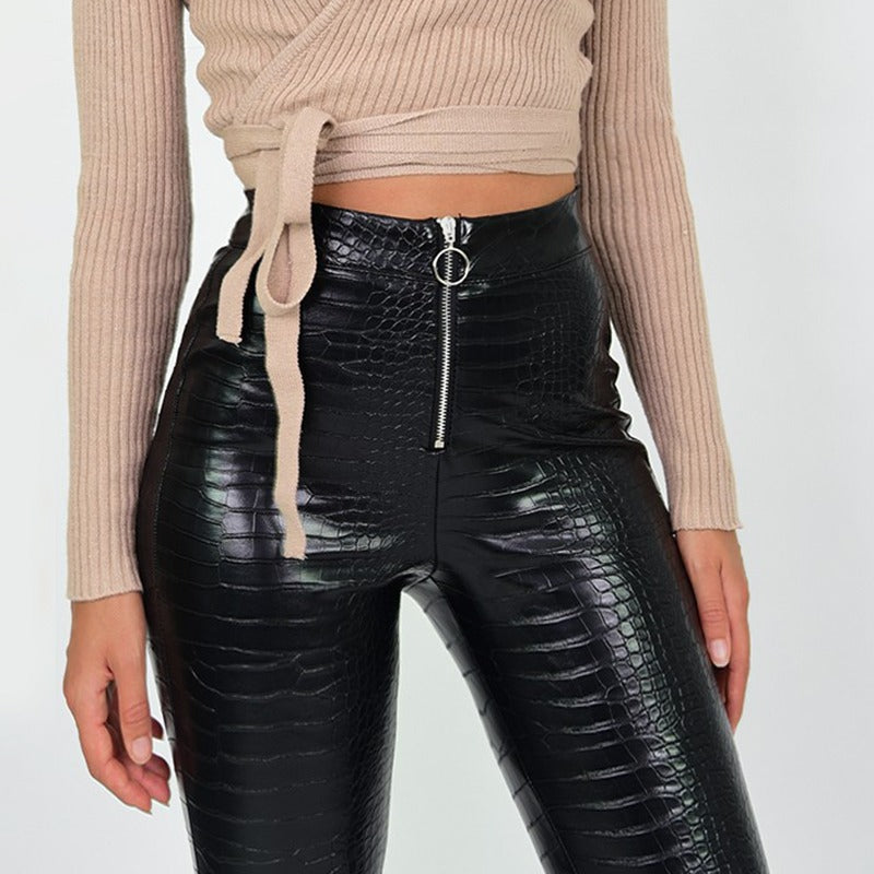 Elegant high waist faux leather pants with snake print and zip, perfect for rock or goth outfits.