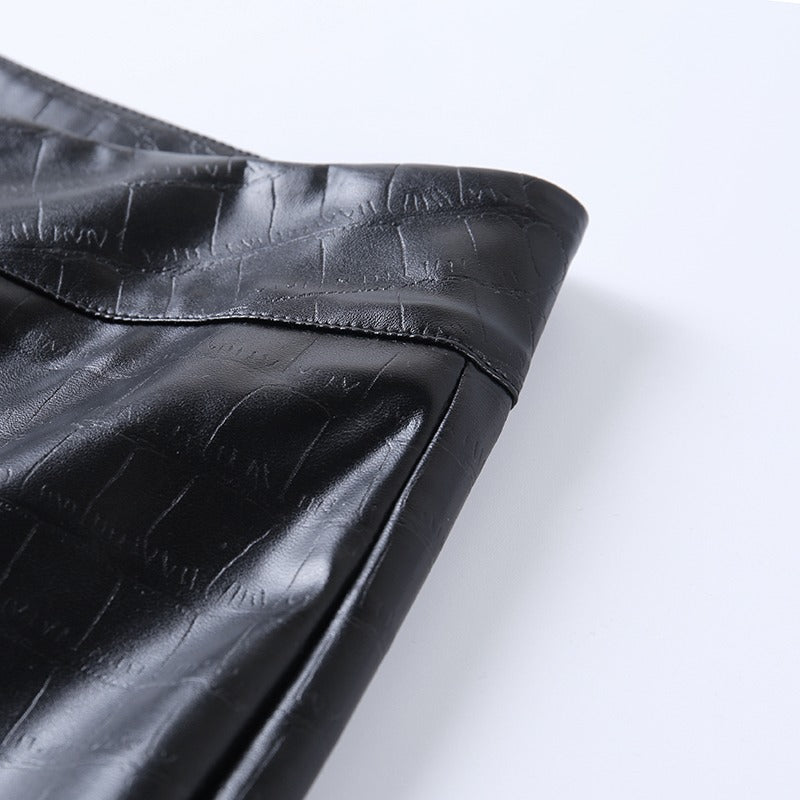 Close-up of elegant high waist faux leather pants showcasing the sleek finish and stylish design perfect for rock outfits.