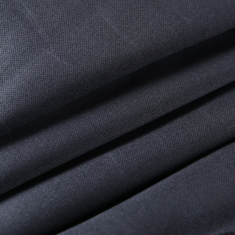 Close-up of smooth black faux leather fabric, showcasing its texture for elegant high waist skinny pants.