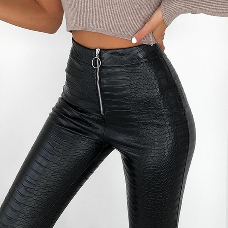 Elegant high waist faux leather skinny pants with snake print and zip, ideal for rock and goth styles.