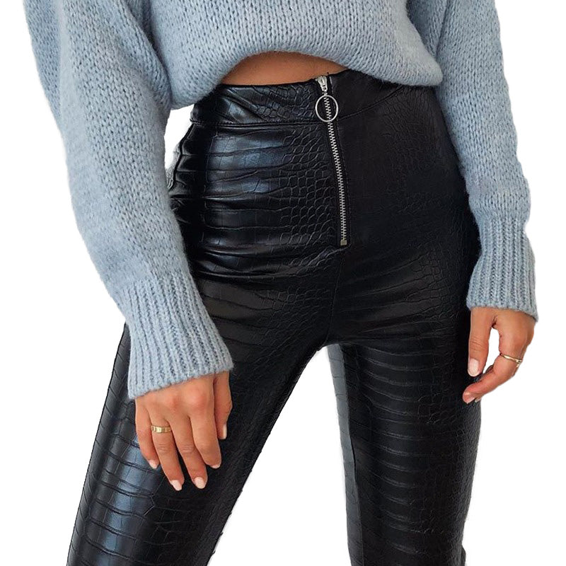Elegant high waist faux leather snake print pants with Gothic zip, styled for a chic rock look.
