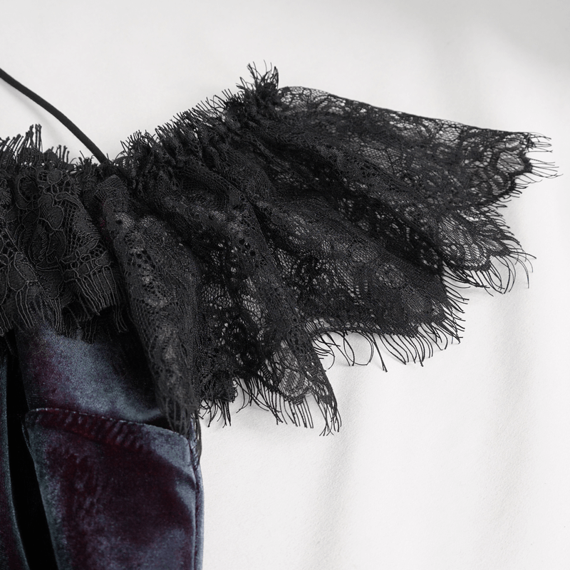 Close-up of elegant black lace appliqué on an off-the-shoulder top, showcasing vintage gothic style and delicate details.