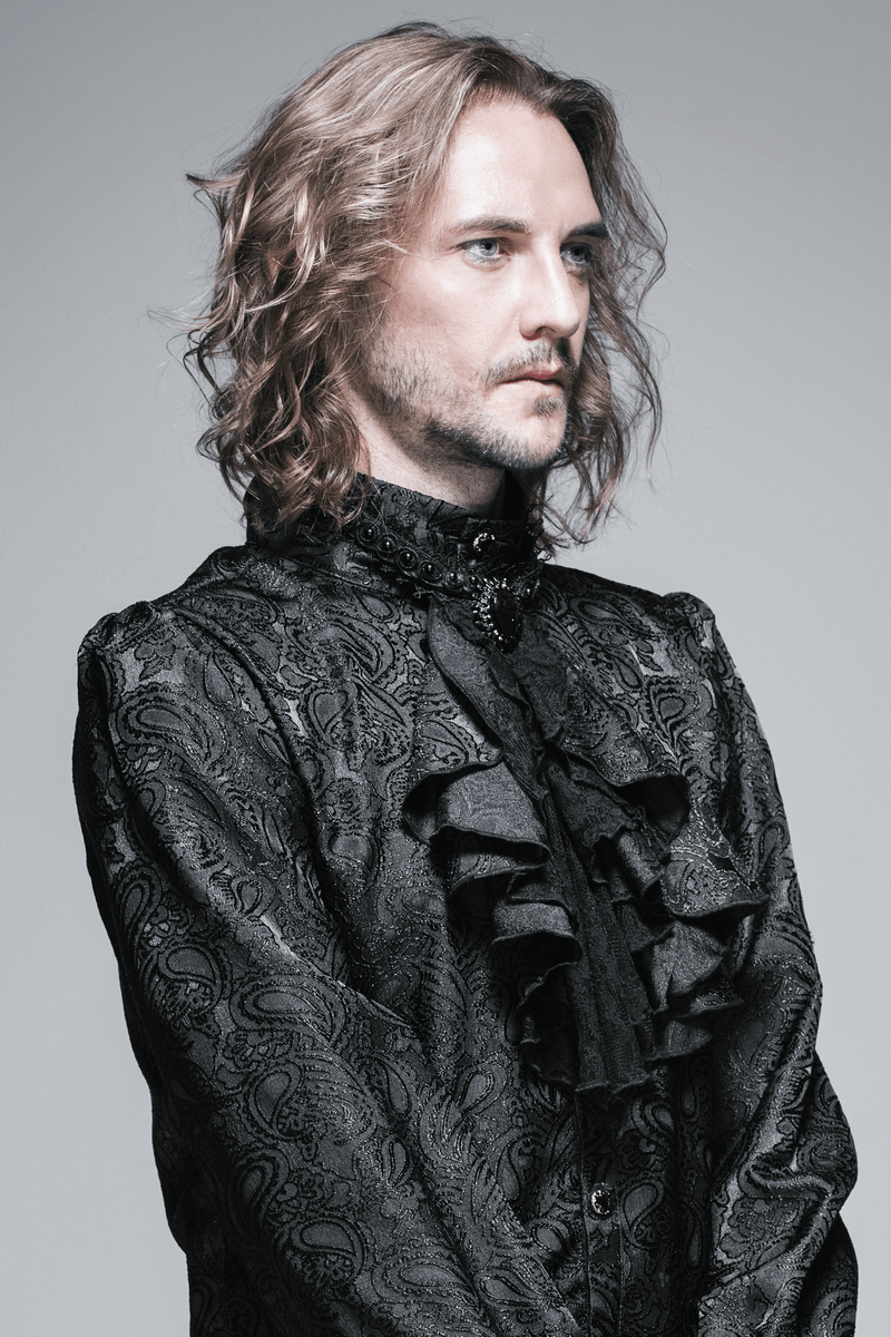 Elegant man in a black patterned shirt showcasing Victorian gothic style, perfect for stylish accessories.