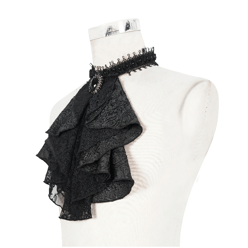 Elegant black satin jabot with ruffled design and brooch, perfect for Victorian gothic fashion accessories.