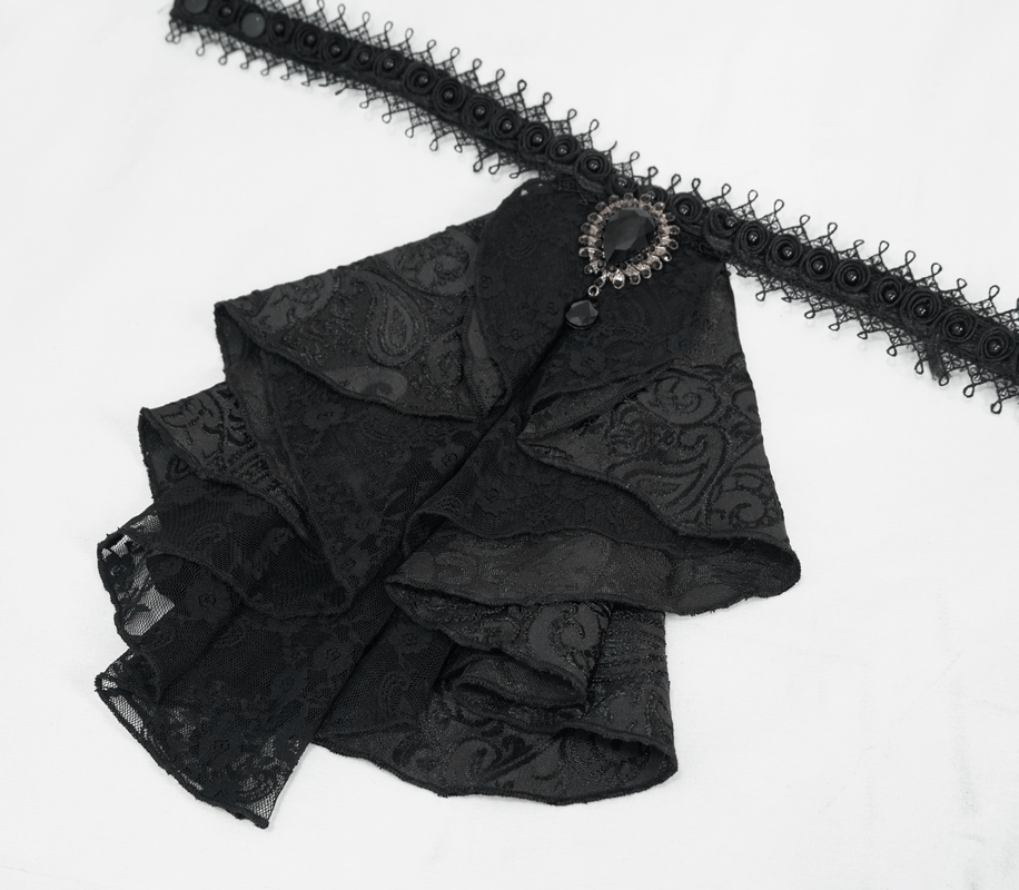 Elegant black patterned satin jabot tie with brooch, perfect for gothic style outfits.