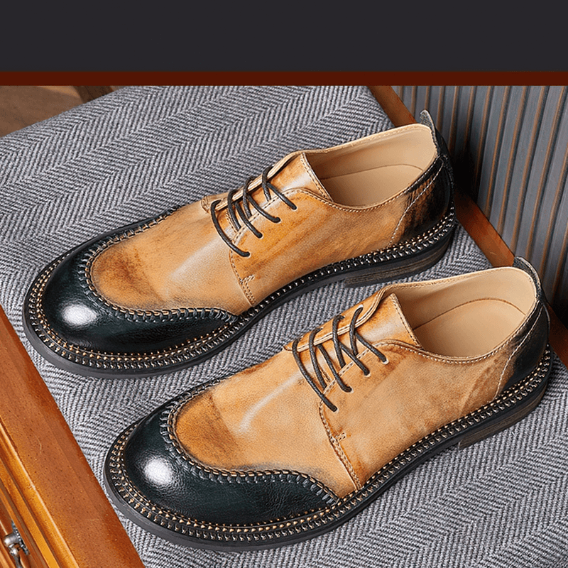 Stylish men's retro leather shoes in tan and black, featuring breathable design and lace-up detail.