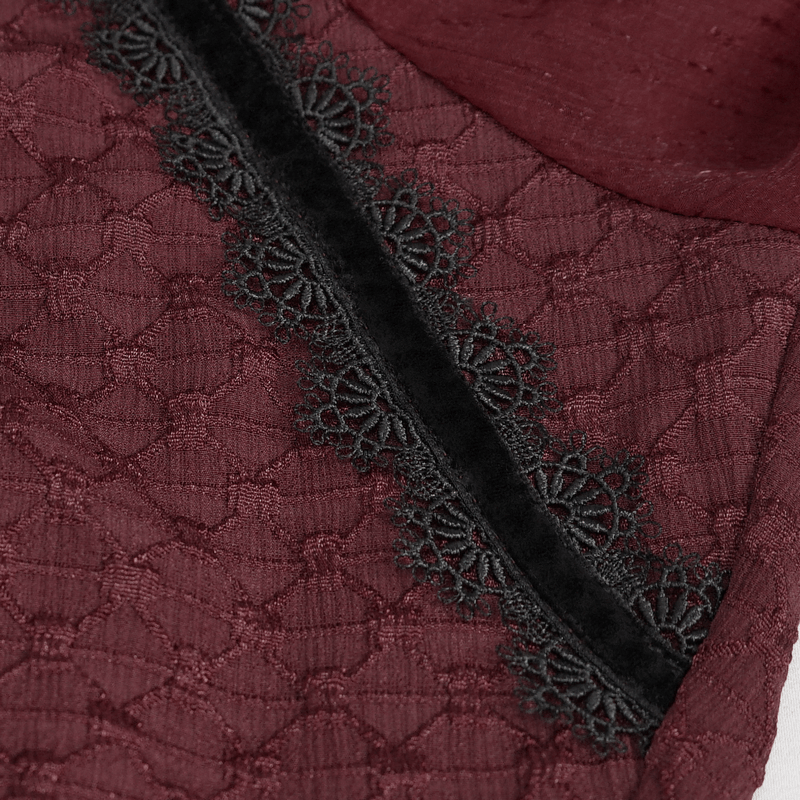 Close-up detail of the elegant maroon fabric with black lace trim showcasing a gothic style.
