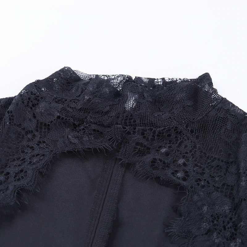 Close-up of elegant black lace neckline on a mini party dress for women, showcasing intricate floral details.