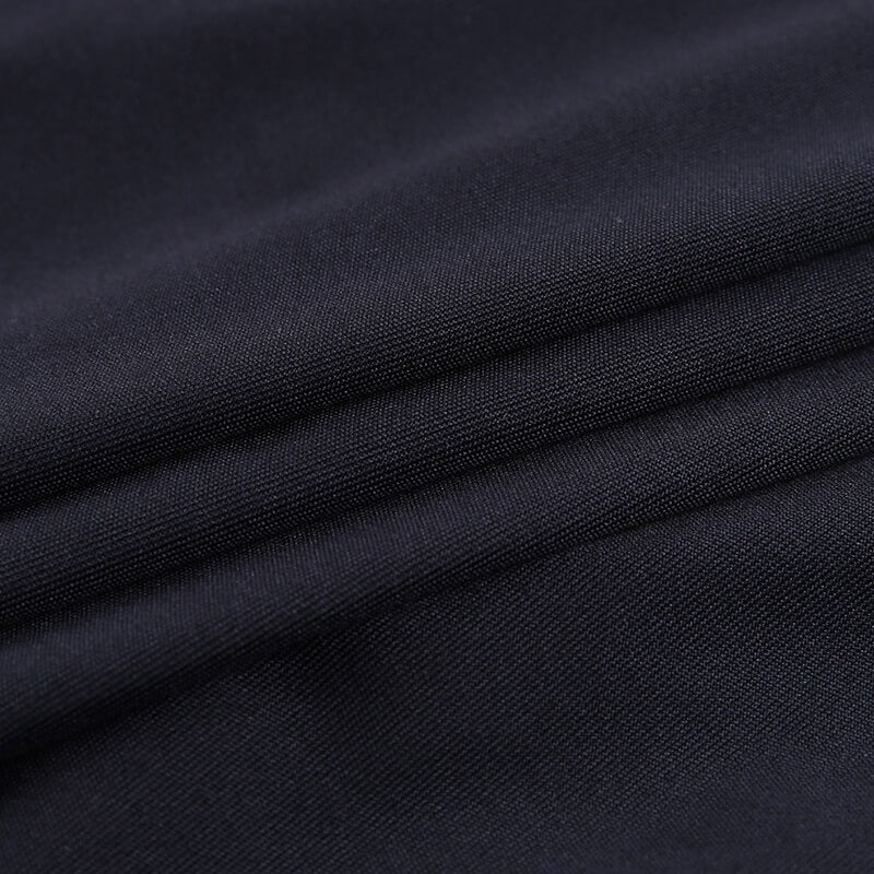 Close-up of soft black fabric, perfect for an elegant mini party dress with lace details.