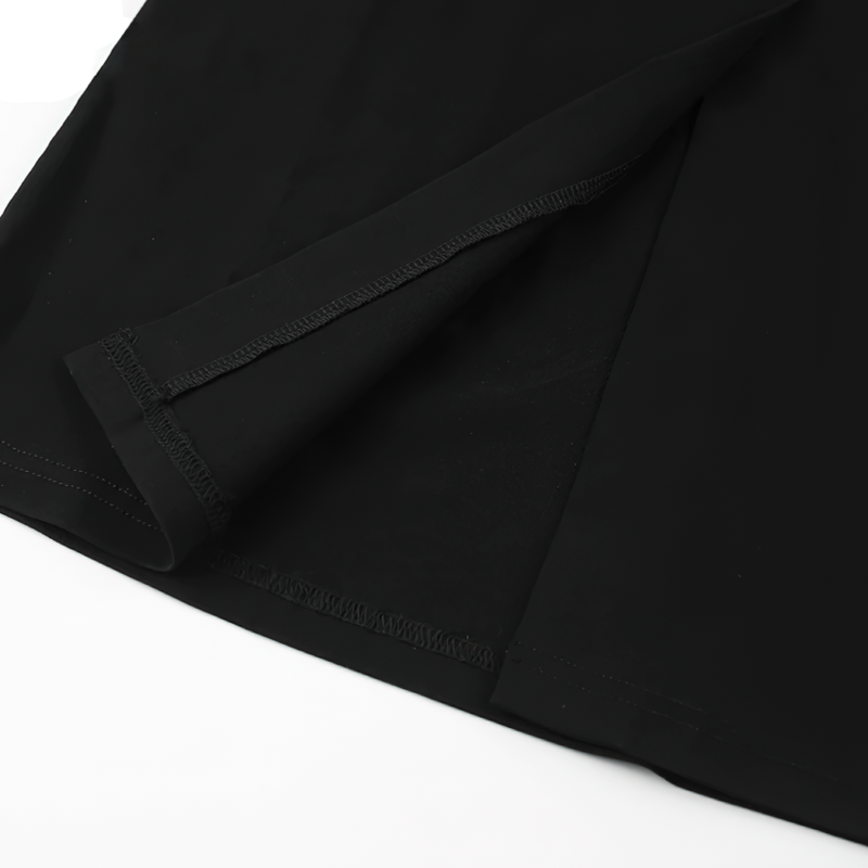 Detail of the hem and fabric on an elegant long black dress with sleeves for women's fashion.