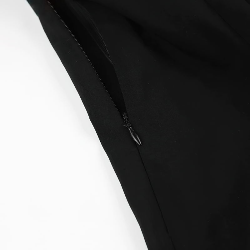 Close-up of the sleek zip detail on an elegant women's black dress, showcasing gothic style and modern design.