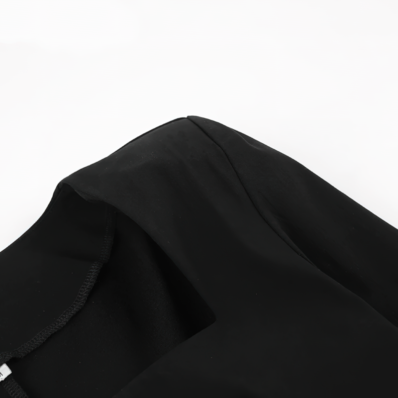 Close-up of the elegant neckline and sleeve detail of a women's black gothic long dress.