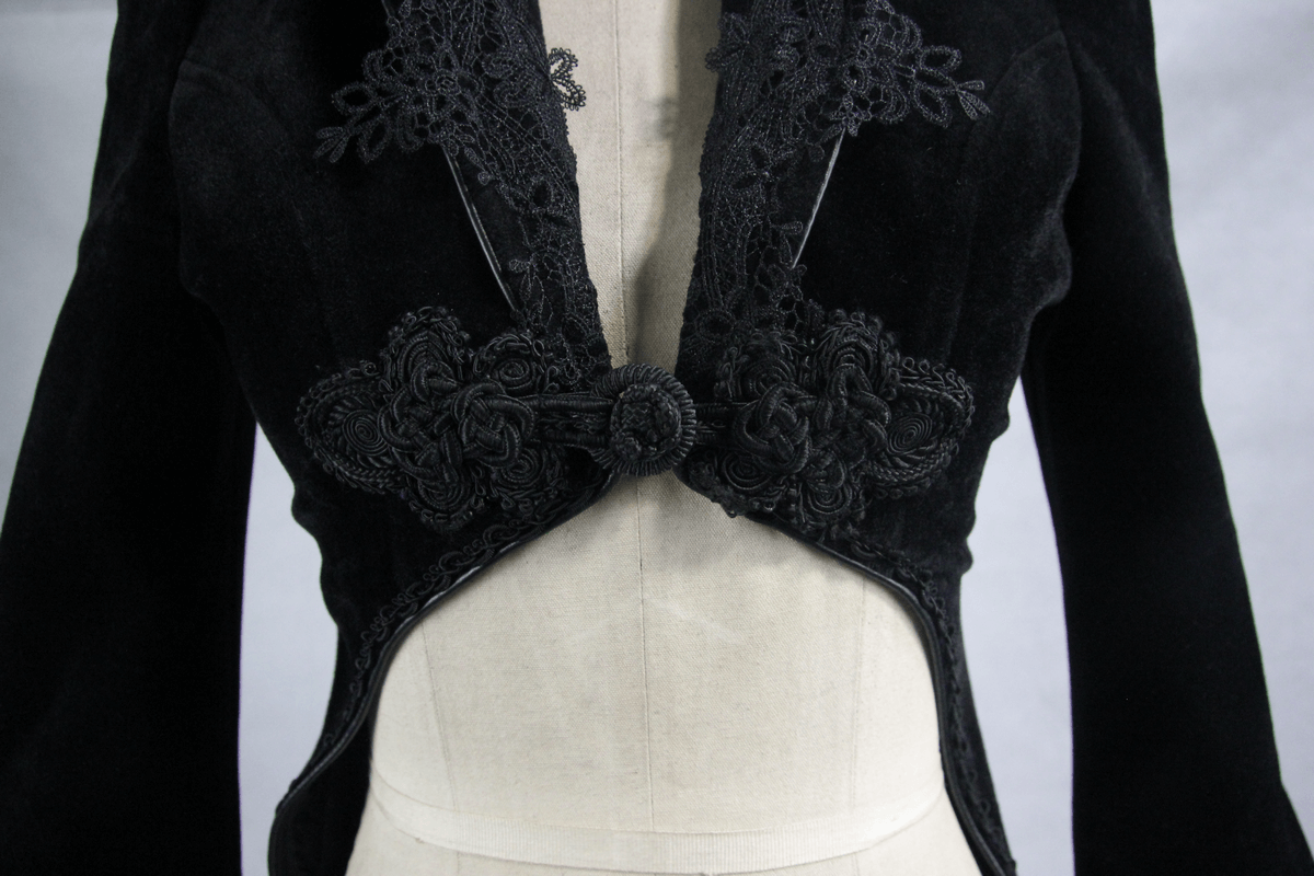 Elegant black velvet coat showcasing beautiful embroidery and a stylish closure, perfect for gothic fashion lovers.
