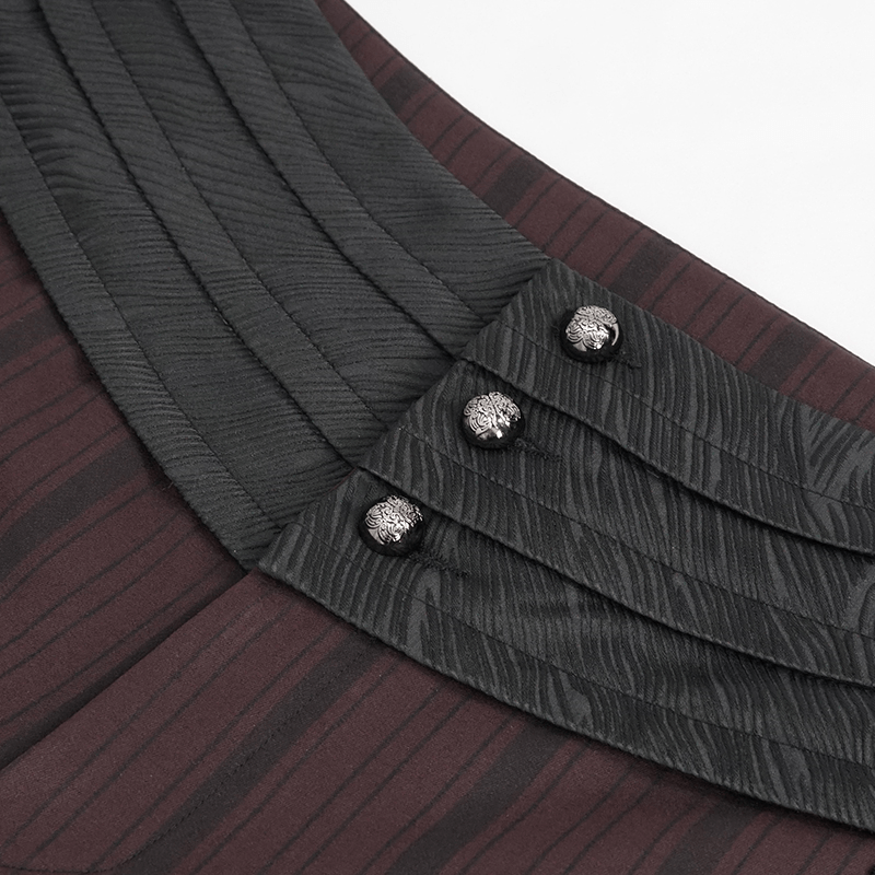 Close-up of elegant wine red straight high-waisted pants featuring a black pleated waistband and stylish button detailing.