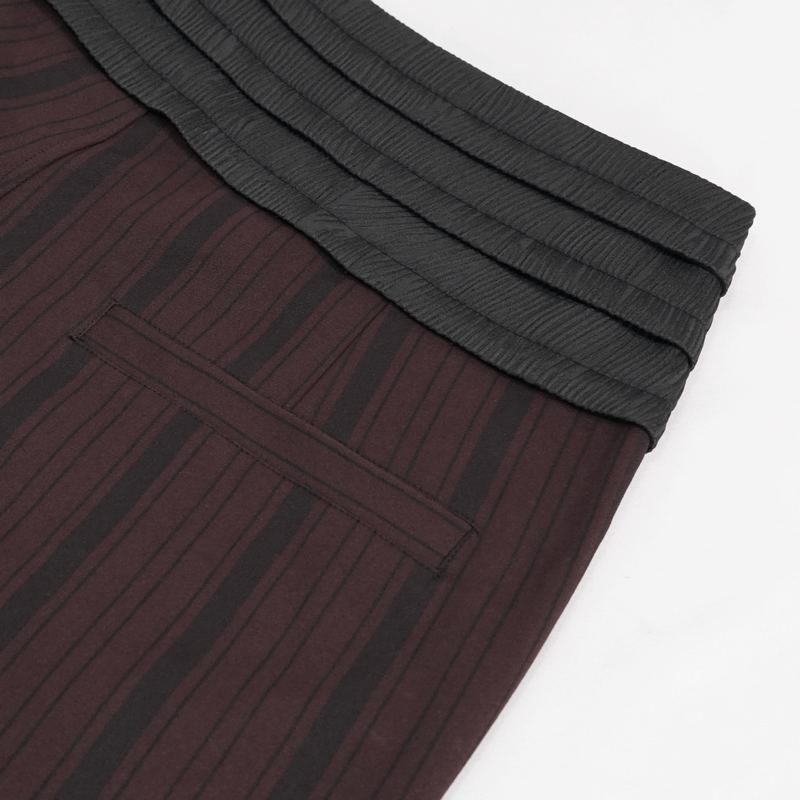 Close-up of elegant wine red high-waisted pants with ribbed black waist and pocket, perfect for gothic fashion.