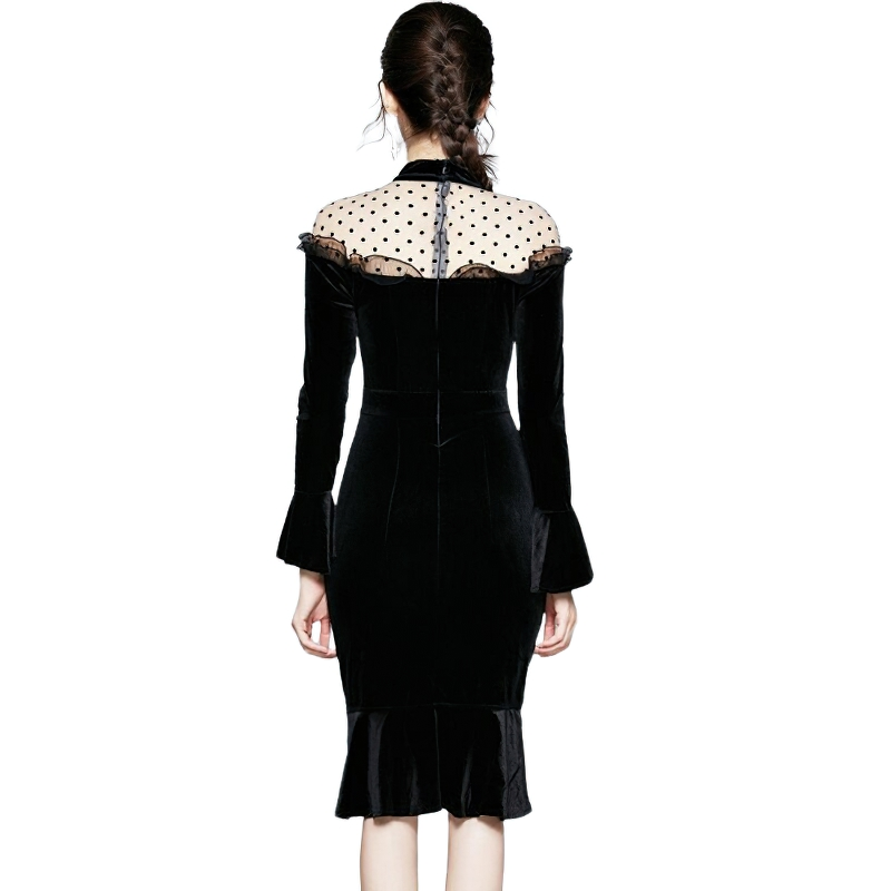 Elegant women's gothic velvet dress with long sleeves and polka dot sheer inserts, showcasing a chic back design.