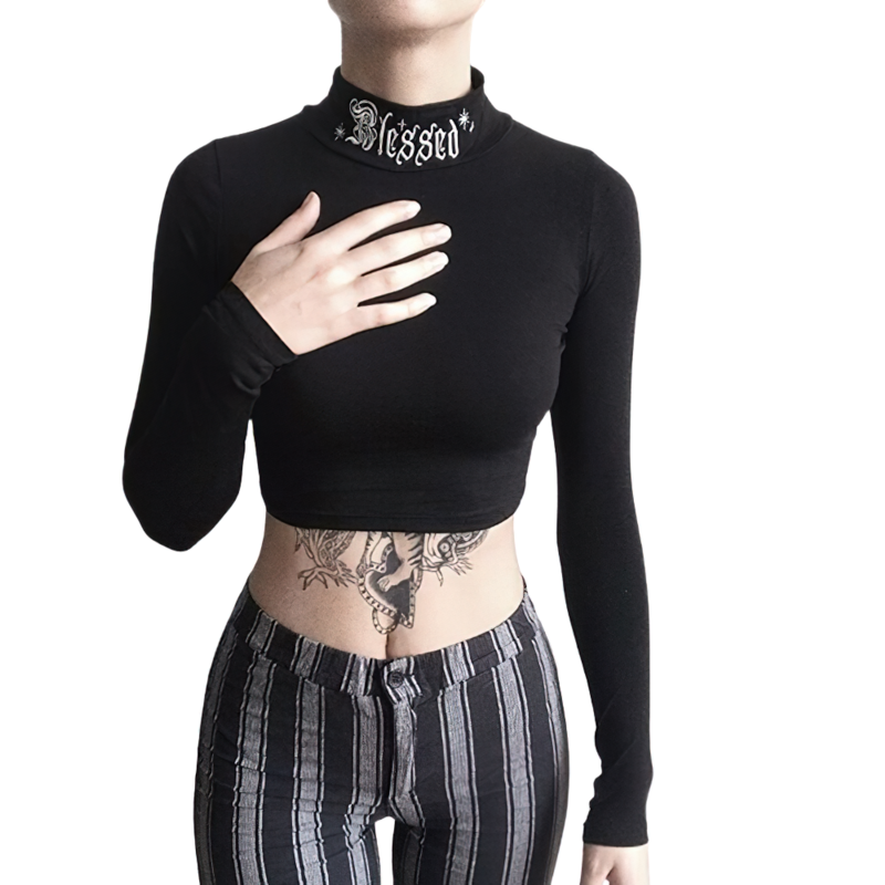 Elegant women's gothic long sleeve crop top with 'Blessed' collar, paired with stylish striped pants.