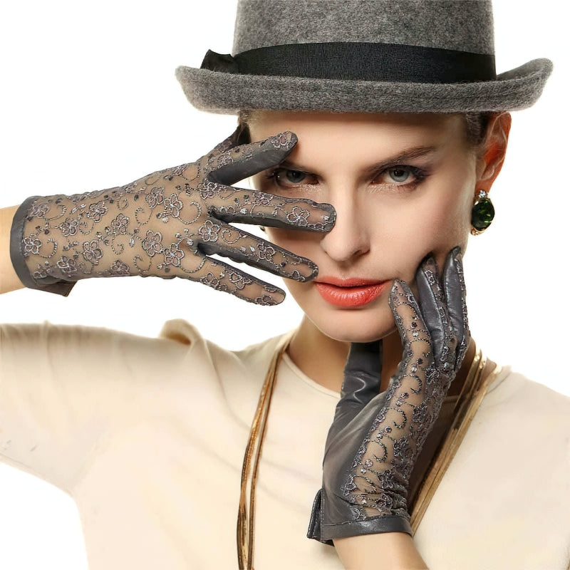 Elegant women's genuine leather gloves with lace details, perfect for vintage-inspired outfits and fancy nights out.