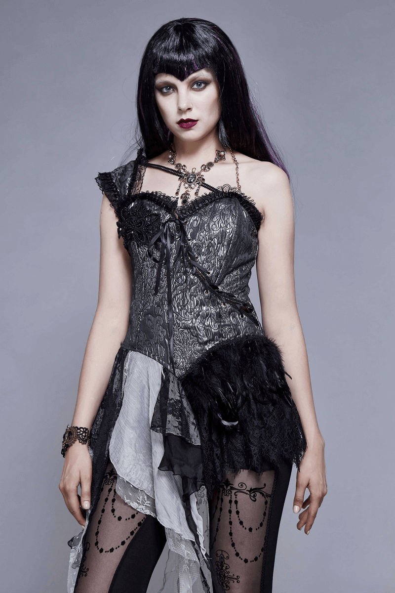Stunning gothic fashion model in a black and gray dress with lace, showcasing a dramatic, dark style.