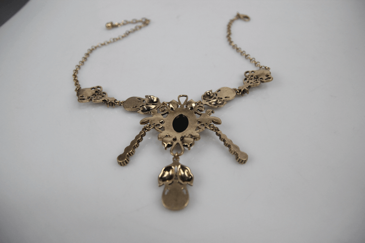 Elegant retro women's necklace with intricate design and pendant, showcasing timeless charm and sophistication.