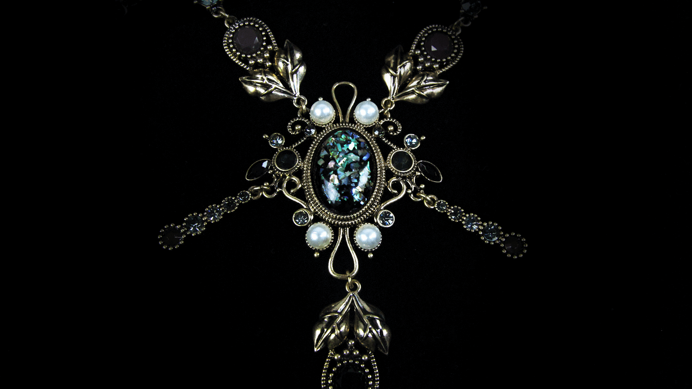 Elegant women's necklace with pearls and retro pendant stones, showcasing intricate vintage design and refined charm.