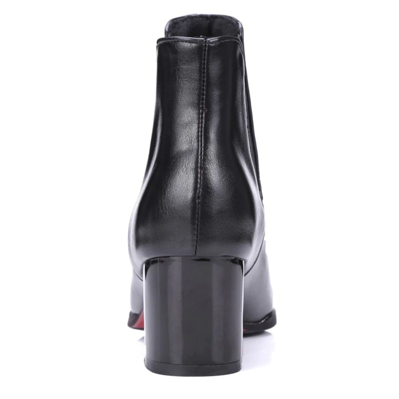 Elegant black women's pointed ankle boots featuring a thick heel and stylish design, perfect for casual outings.