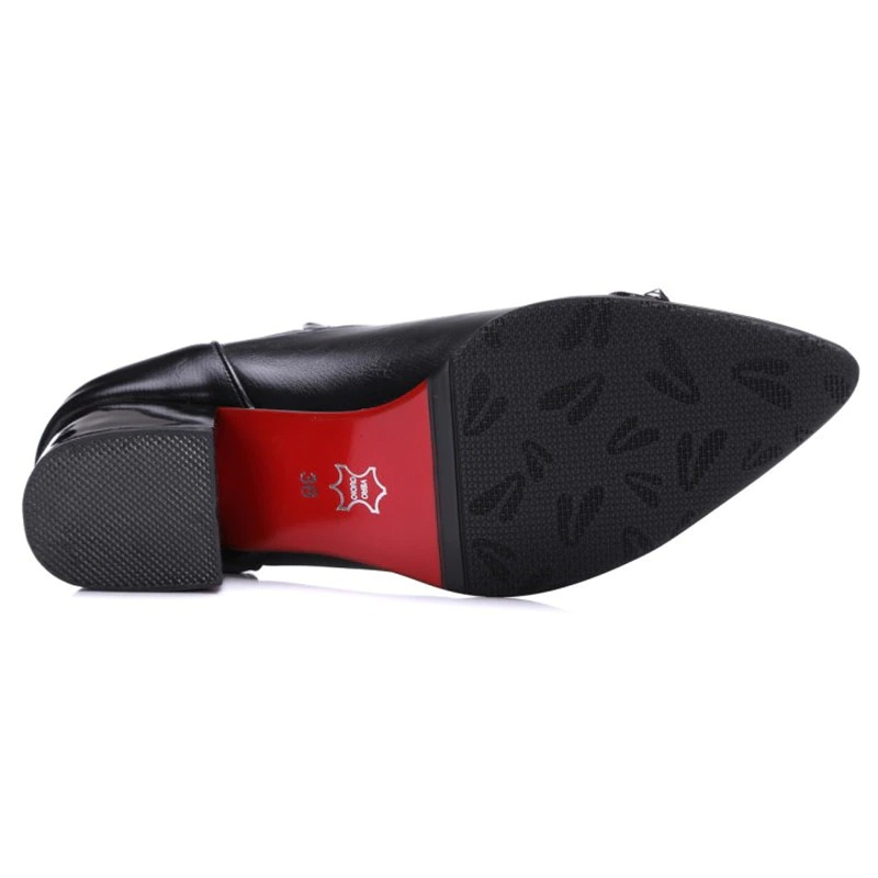 Sleek black women's pointed ankle boot sole with stylish red accent and textured grip for elegance and comfort.