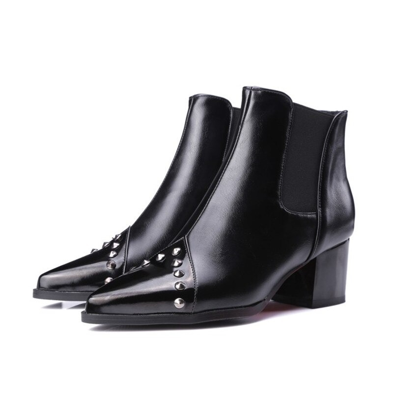 Elegant women's pointed thick ankle boots in black with spikes, perfect for casual styles and adding sophistication.