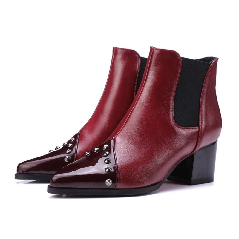 Elegant women's pointed ankle boots in burgundy with spikes and thick heels, perfect for casual style.