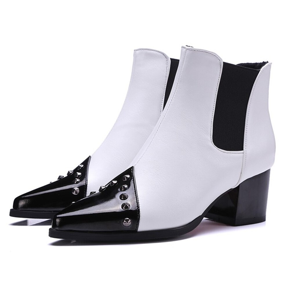 Elegant white pointed ankle boots with black accents and spikes, perfect for casual wear and adding sophistication.