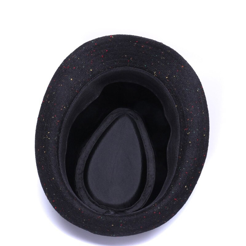 Interior view of an elegant black woolen hat with a colorful speckled design, showcasing its stylish and comfortable lining.