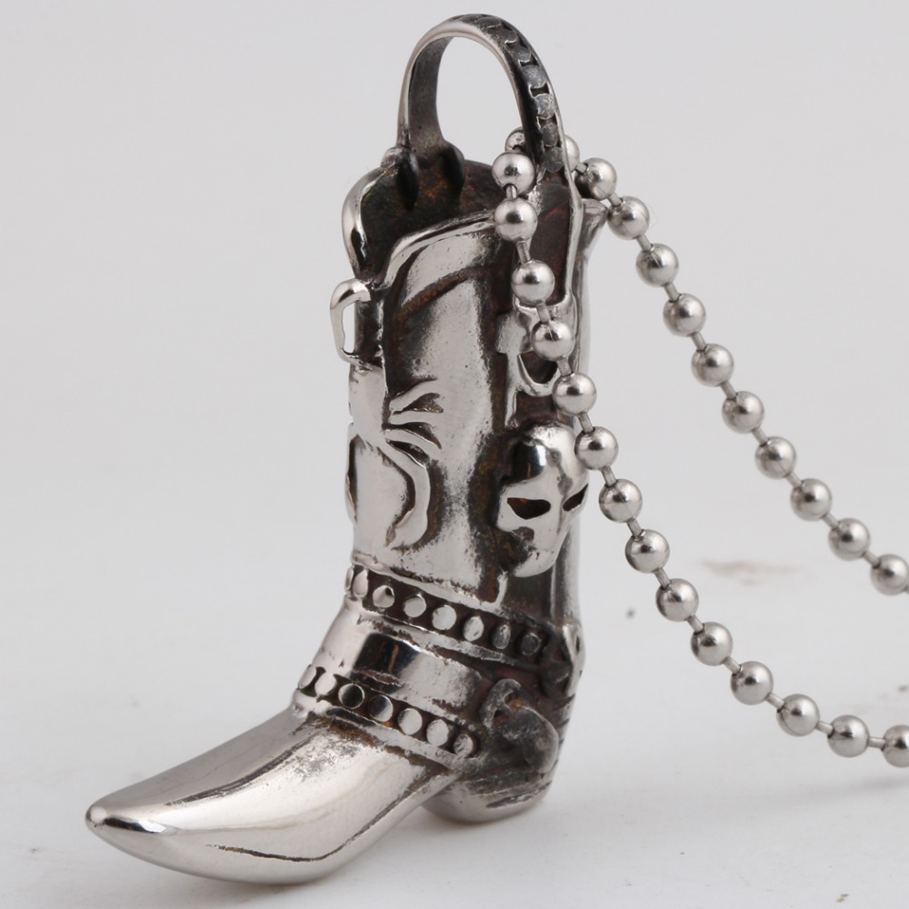 Engraved skull boot pendant necklace in stainless steel, perfect for rock style outfits.