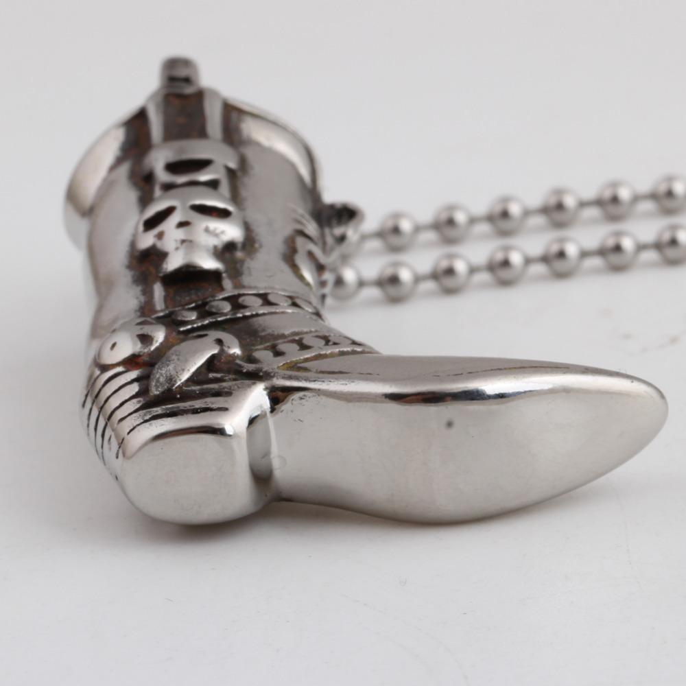 Engraved skull boot pendant necklace in stainless steel, perfect for punk and rock style outfits.
