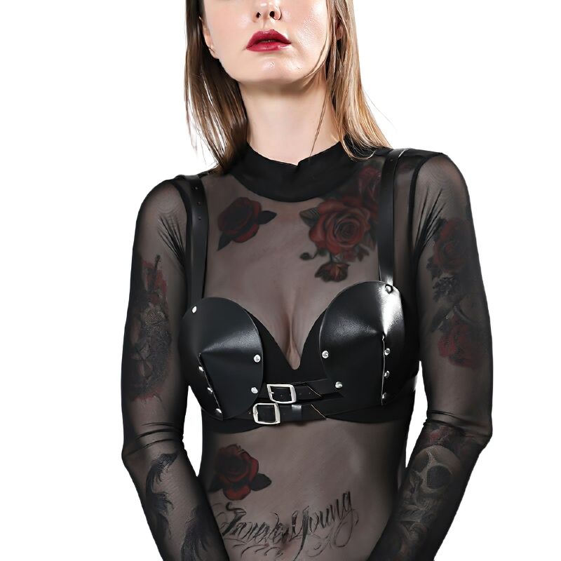 Gothic women's BDSM body bra in black PU leather with silver rivets, worn over a sheer mesh top.