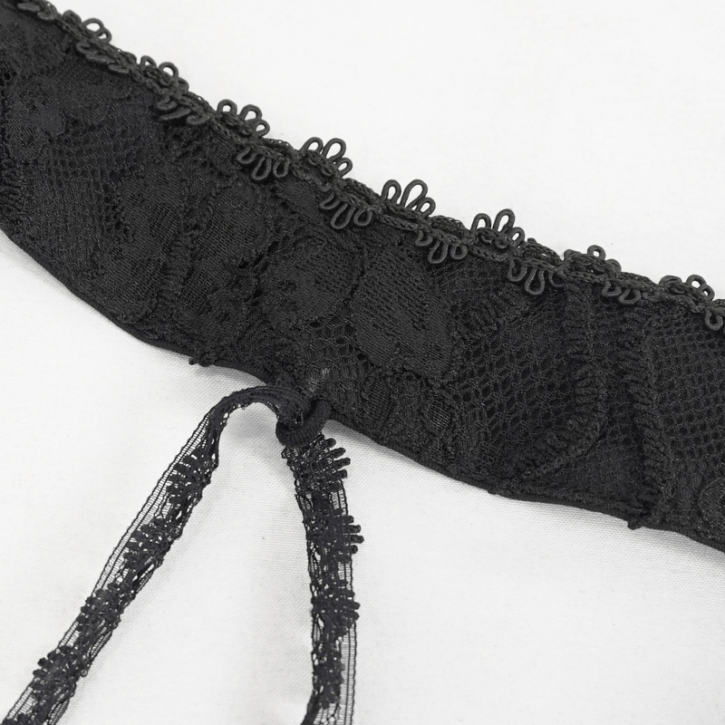 Close-up of black lace detailing on erotic two-piece lingerie, showcasing elegant gothic style and intricate design.
