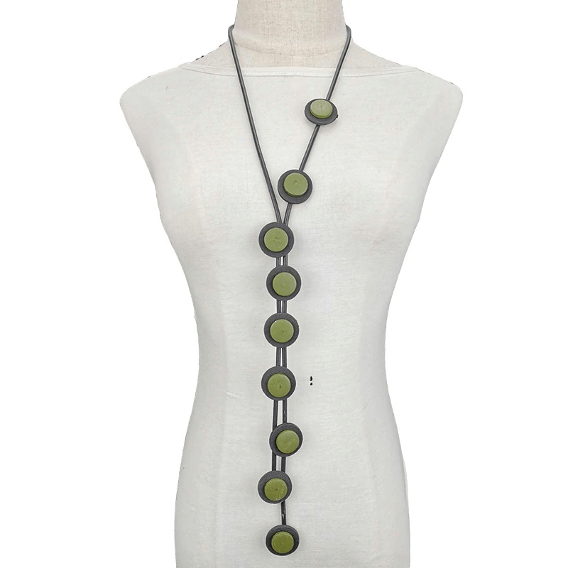 Ethnic long pendant necklace for women, featuring green rubber accents and a sleek gothic design.