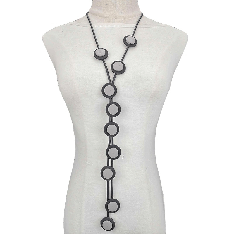 Ethnic long pendant necklace for women featuring a gothic design with rubber materials and circular accents.