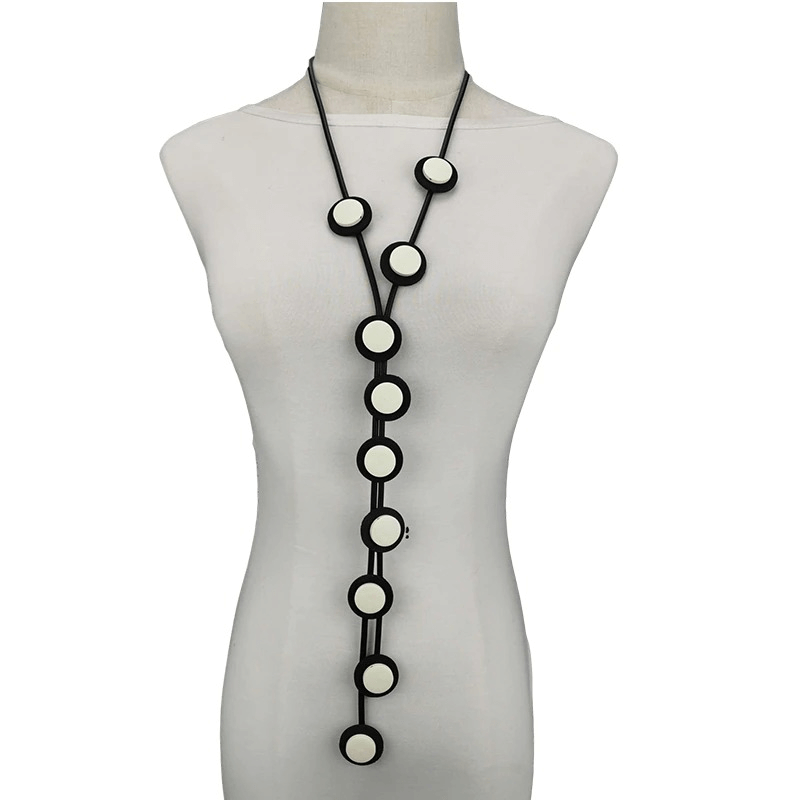 Stylish ethnic long pendant necklace for women, featuring a gothic design with rubber materials and circular accents.