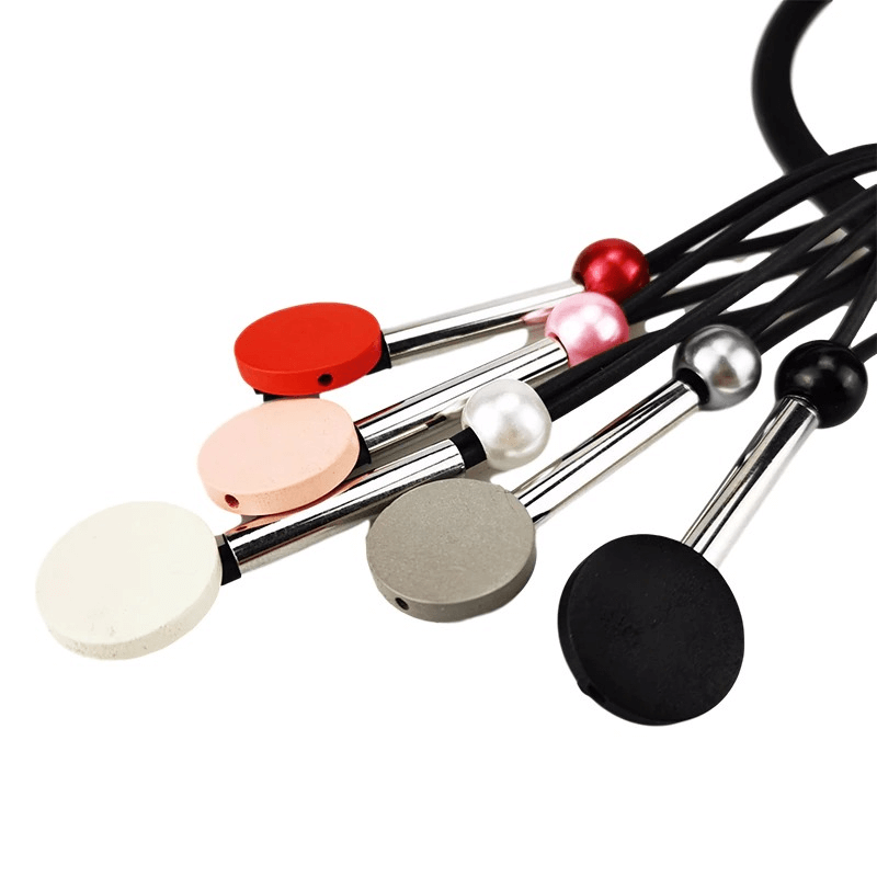 Colorful handmade silicone chokers with unique round pendants in various shades.