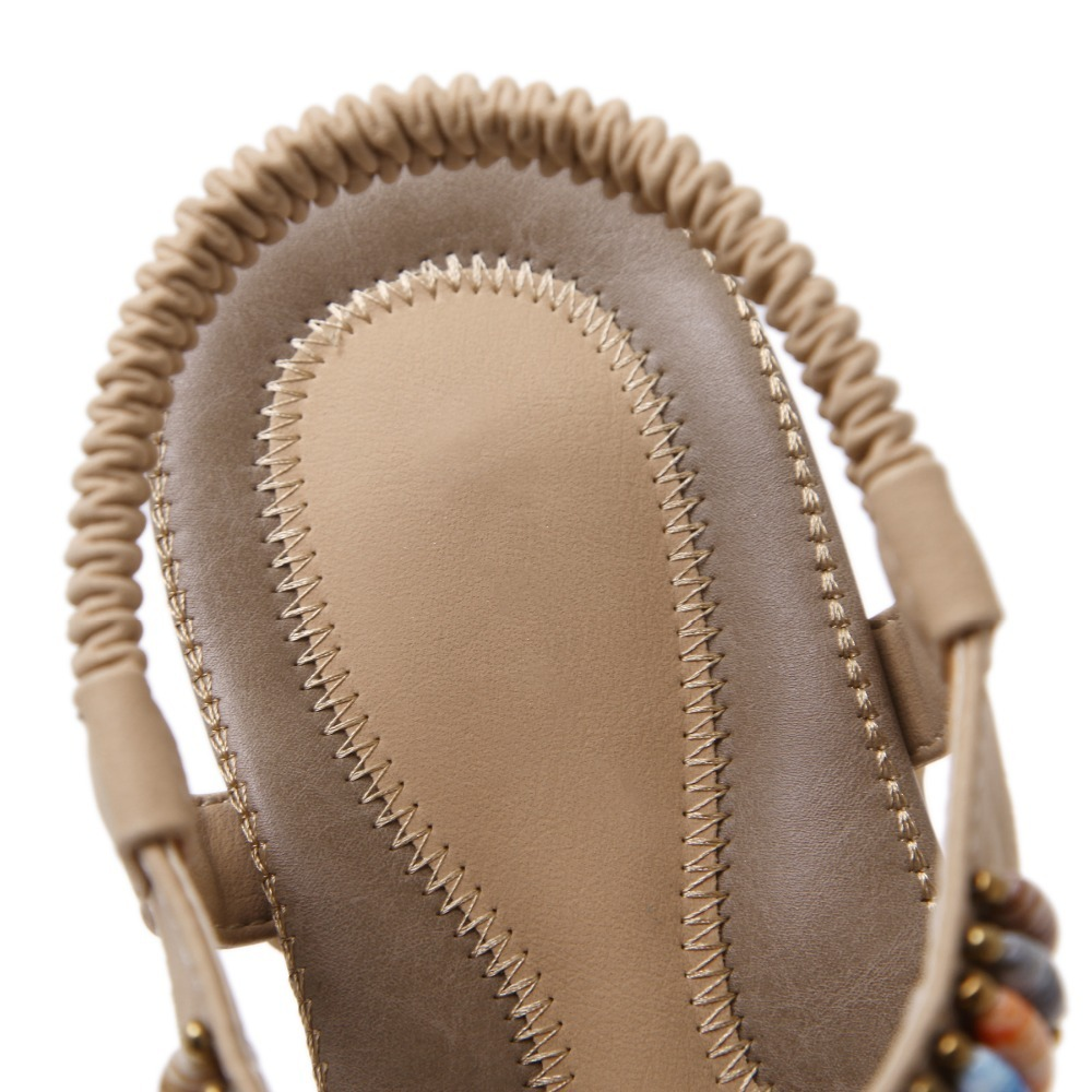 Top view of ethnic style women's beaded sandals with elastic band and decorative stones, perfect for summer outfits.