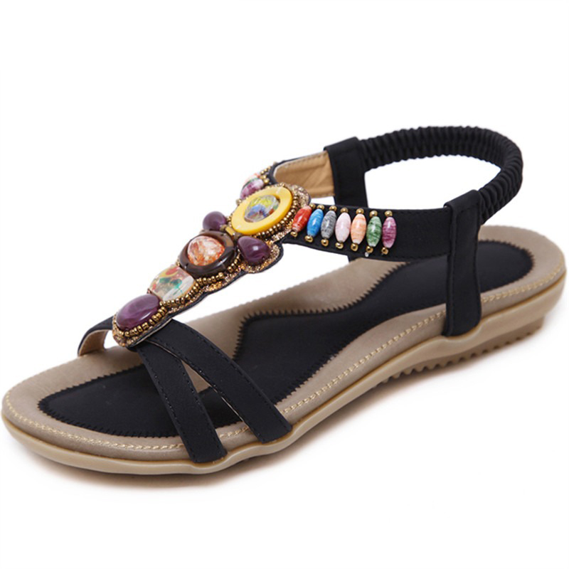 Ethnic style women's beaded sandals with decorative stones, perfect for summer outfits and floral dresses.