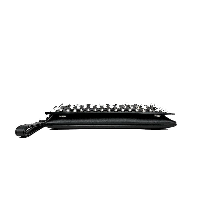 Stylish black women's evening clutch bag with star rivets, featuring a sleek design for rock-inspired outfits.