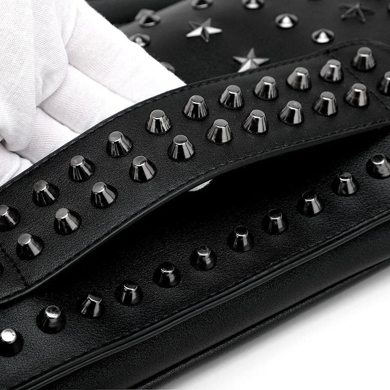 Close-up of a women's evening clutch with rivets and star studs, showcasing its rock style design.