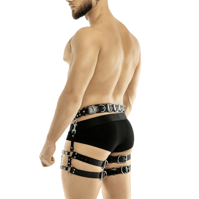 Men's adjustable faux leather body harness in punk style, showcasing a bold look with waist and leg garters.