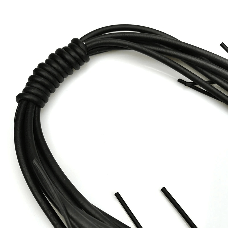 Close-up of the intricate detailing of a long black necklace made from quality silicone materials.