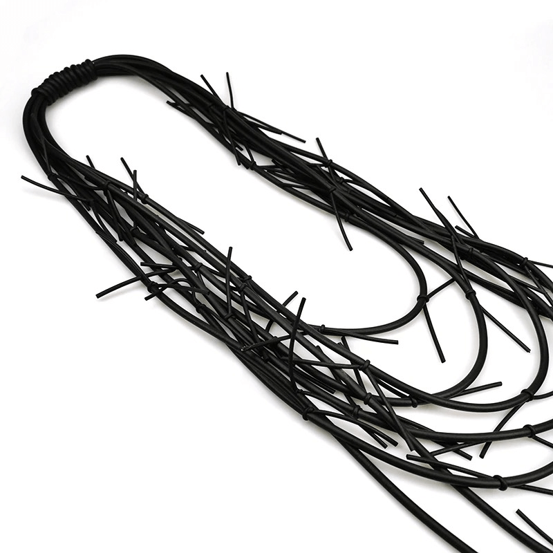 Exquisite long black necklace showcasing gothic punk silicone design for women, perfect for accessorizing outfits.