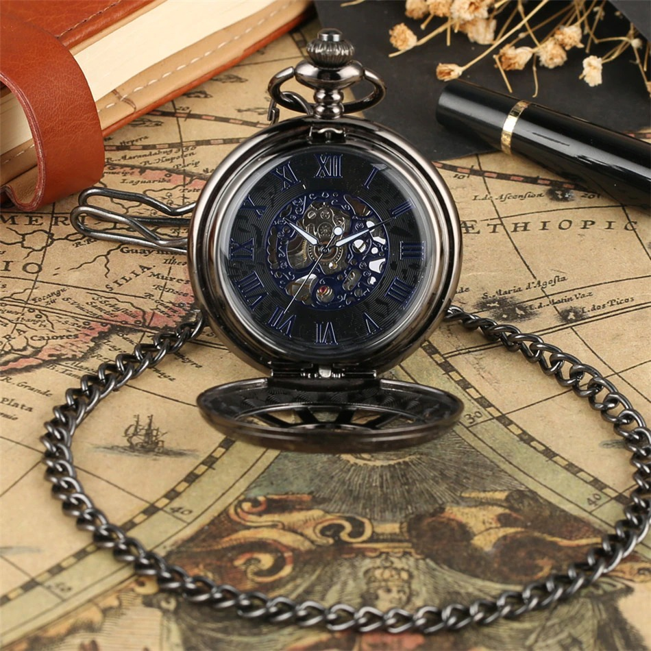 Exquisite antique mechanical pocket watch with a dark blue face, on a vintage map, showcasing its elegant design.