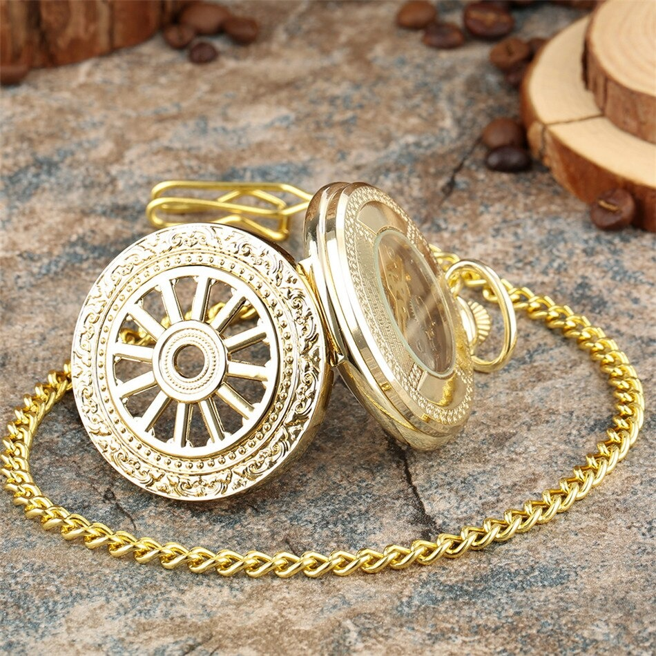 Elegant gold mechanical pocket watch with intricate design and chain on a rustic surface.